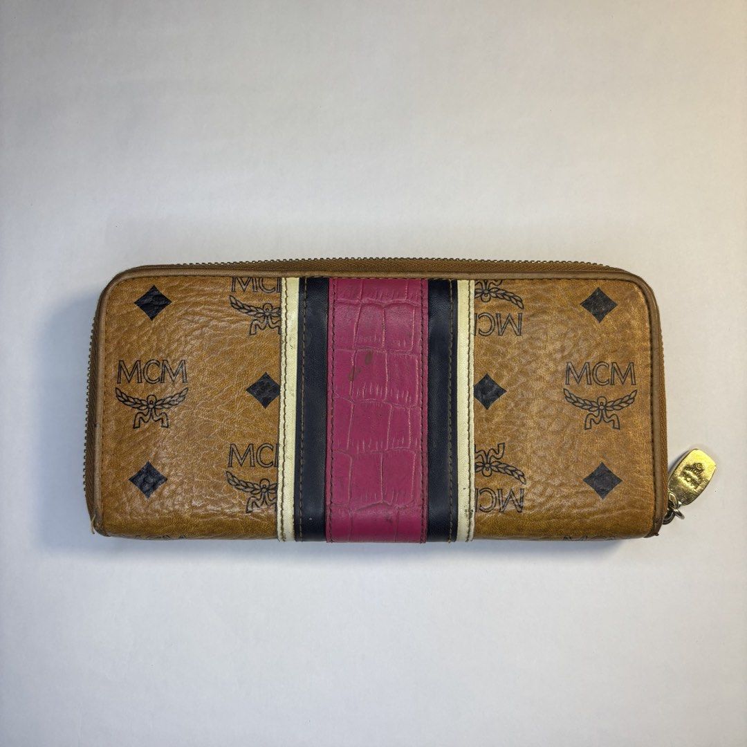 Mcm Long wallet (Category: Luxury Bags & Wallets) located in Paranaque City. Submitted by smthngincbn_ (Listing ID 1459267527, Image 2). Description: Mcm Long Wallet Authentic 9.5/10 Color Rate Issue indicated in the pictures Parañaque loc.