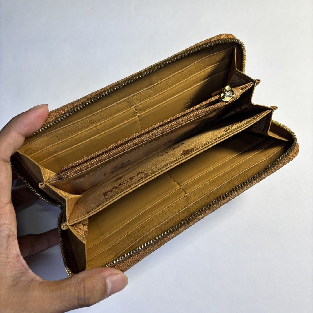 Mcm Long wallet (Category: Luxury Bags & Wallets) located in Paranaque City. Submitted by smthngincbn_ (Listing ID 1459267527, Image 3). Description: Mcm Long Wallet Authentic 9.5/10 Color Rate Issue indicated in the pictures Parañaque loc.