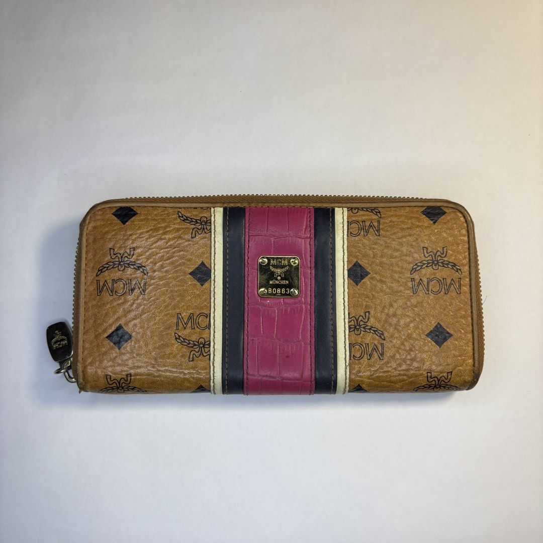 Mcm Long wallet (Category: Luxury Bags & Wallets) located in Paranaque City. Submitted by smthngincbn_ (Listing ID 1459267527, Image 1). Description: Mcm Long Wallet Authentic 9.5/10 Color Rate Issue indicated in the pictures Parañaque loc.