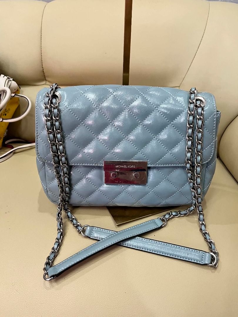 Michael Kors light blue quilted leather-med (Category: Luxury Bags & Wallets) located in Cebu City. Submitted by nbetcuban007trendyfinds (Listing ID 1459224357, Image 2). Description: Light blue quilted leather shoulder bag featuring a silver-tone push-lock closure stamped. VERSATILE CHIC - Transition seamlessly from day to night. TIMELESS APPEAL - A classic piece that never goes out of style. LUXURIOUS COMFORT - Soft leather that feels as good a