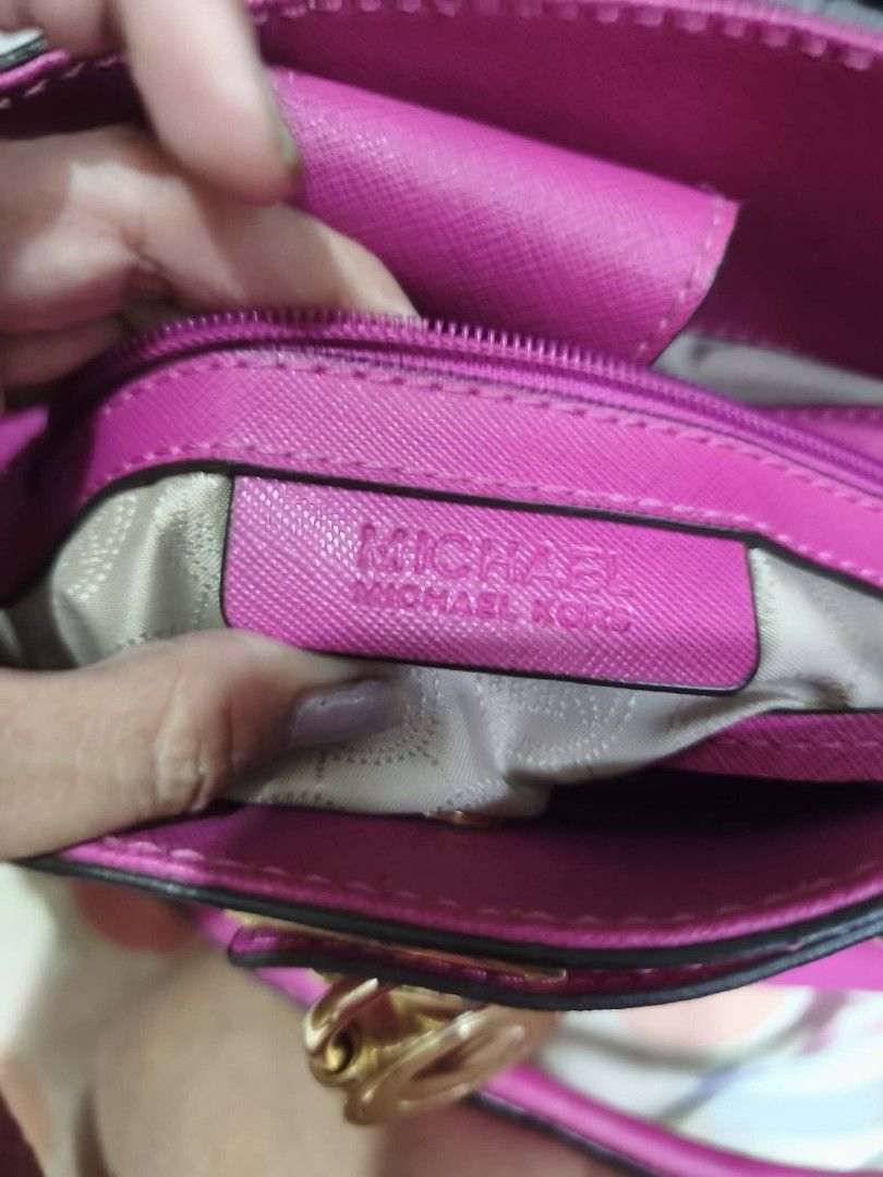 Michael Kors Pink Leather Satchel Bag (Category: Luxury Bags & Wallets) located in San Juan City. Submitted by bellarina05 (Listing ID 1459133908, Image 2). Description: - Authentic Michael Kors satchel bag - Vibrant bright pink saffiano leather - Elegant gold hardware details - Dual top handles for easy carrying - Detachable shoulder strap for versatility - Multiple interior compartments for organization - Ideal for everyday use or as a stylish 