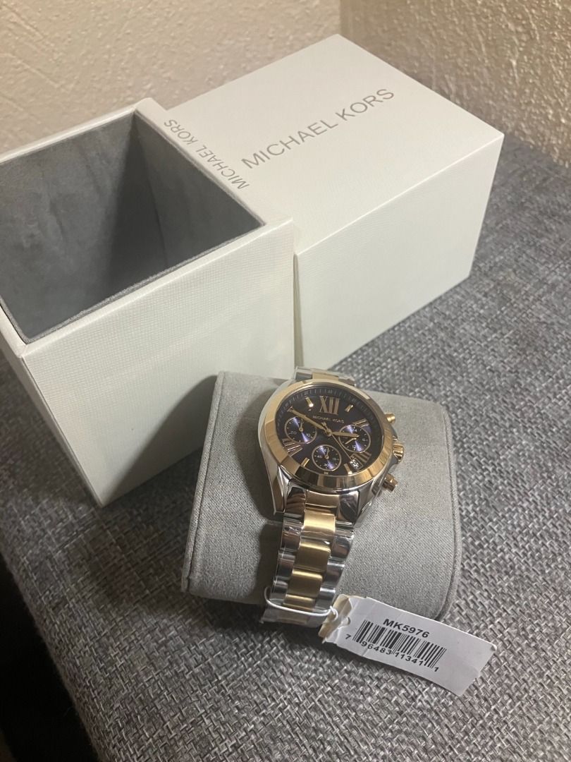 Authentic Michael Kors Women’s Watch (Category: Luxury Watches) located in Taguig. Submitted by ken.siano (Listing ID 1459137518, Image 1). Description: Model: Michael Kors Bradshaw MK5976 💰 Price: ₱3,500 ✨ Details: Never used Still with protective plastic/wrap Complete with original Michael Kors box & tag Chronograph Two-tone silver & gold design Black dial Stainless steel case & bracelet Analog movement Water resistant: 10 ATM Case size: appro