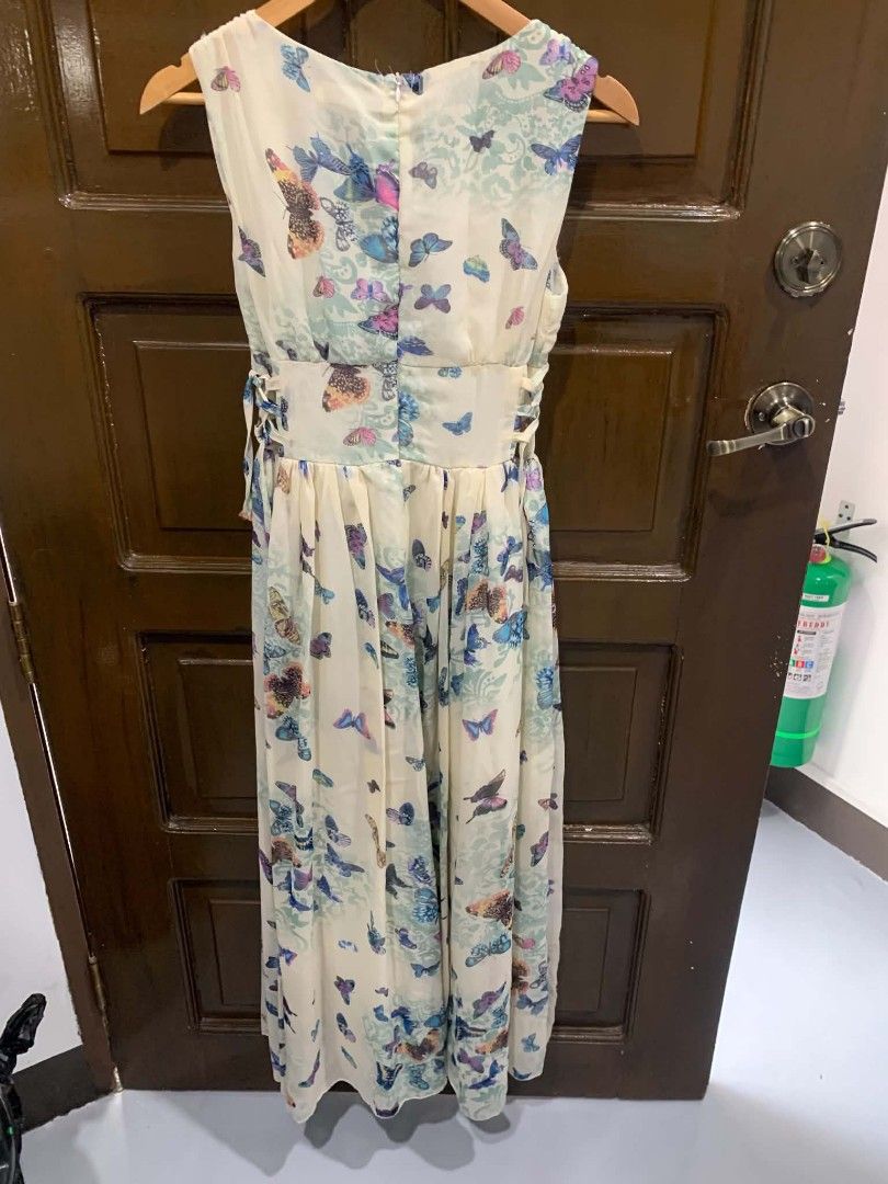 MIGEER Butterfly Print Maxi Dress (Category: Dresses) located in Paranaque City. Submitted by rizatamayo (Listing ID 1459232882, Image 2). Description: - Cream colored maxi dress - Beautiful all-over butterfly print - Sleeveless design - Flattering V-neckline - Cinched waist with adjustable tie at the back - Flowy, elegant skirt - Approximately 50 inches in length - Ideal for casual outings or special events issues:may kunting punit sa kili- kili