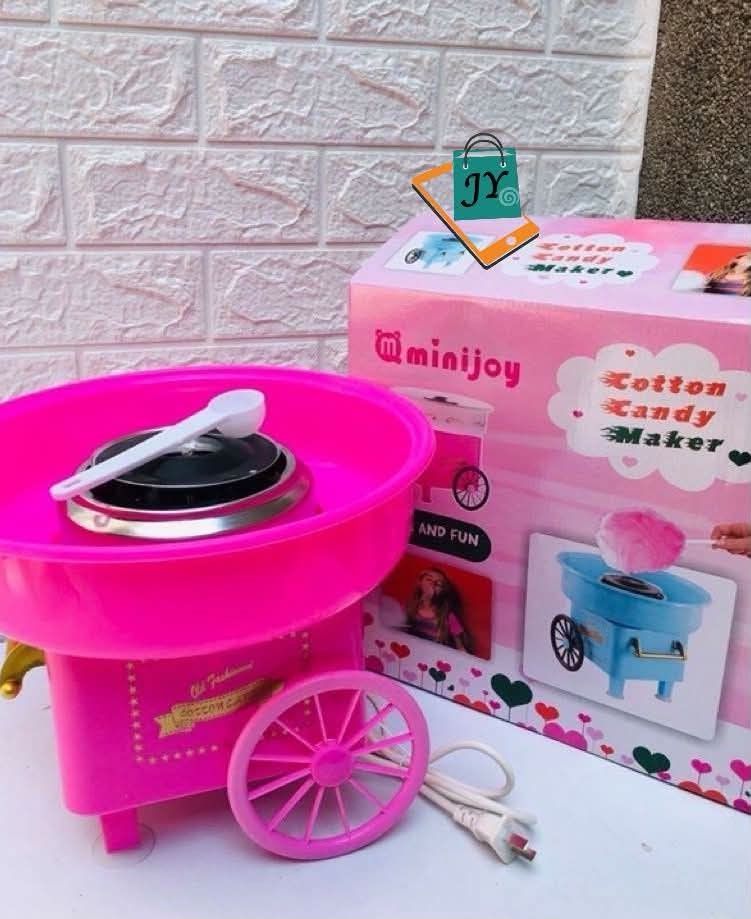 MiniJoy Pink Cotton Candy Maker Machine (Category: Coffee Machines & Makers) located in Manila. Submitted by chaionlineshop (Listing ID 1459106196, Image 2). Description: - Create delicious, fluffy cotton candy at home! - Fun pink machine, ideal for parties and events. - Simple operation: just add sugar and watch the magic. - Enjoyable for both kids and adults. - Comes complete with a scoop and its original packaging..