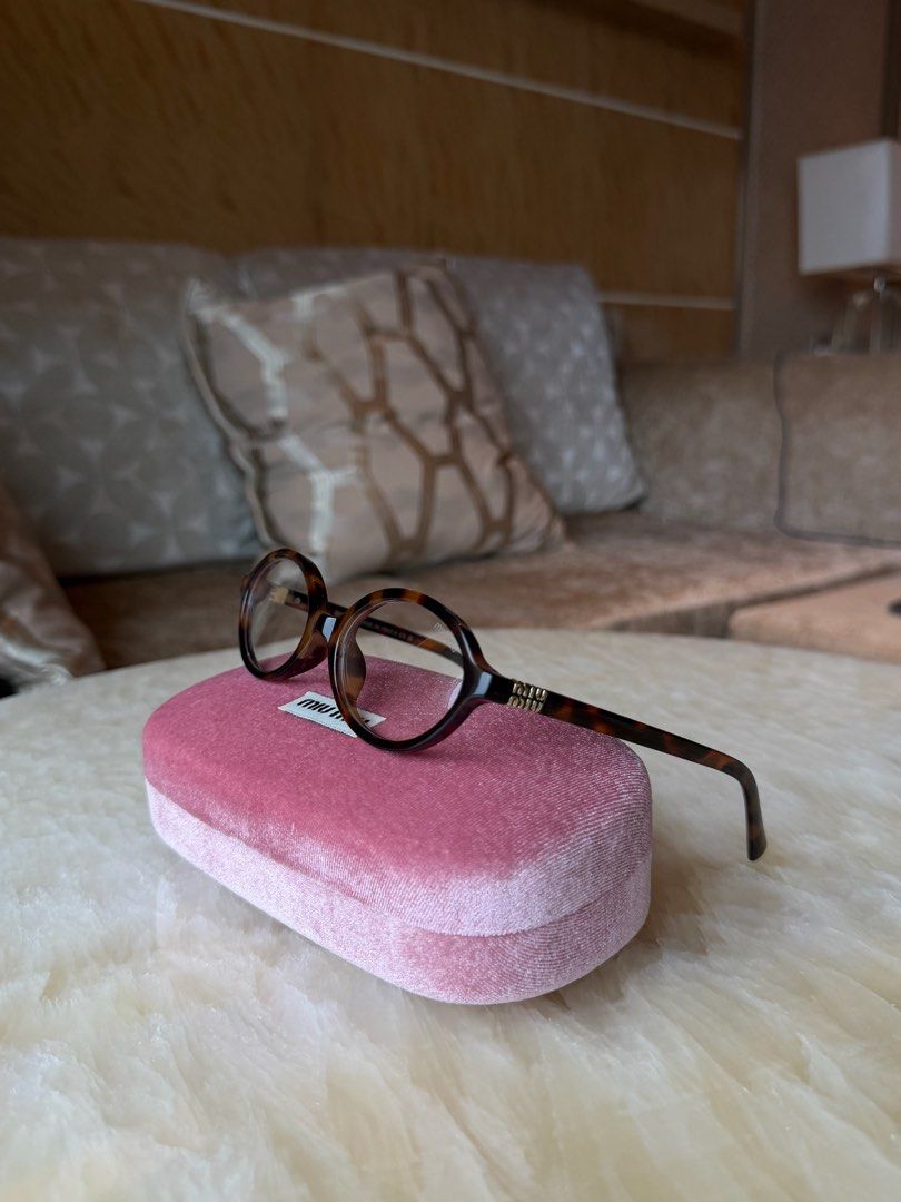 Miu Miu Clear Tortoiseshell Round Eyeglasses (Category: Sunglasses & Eyewear) located in Manila. Submitted by urbanglasses.mnl (Listing ID 1459244069, Image 1). Description: - Sourced from: 🇻🇳 - Stylish tortoiseshell pattern - Classic round frames - Includes Miu Miu case - Can change to prescription frames (lenses need to be replaced).
