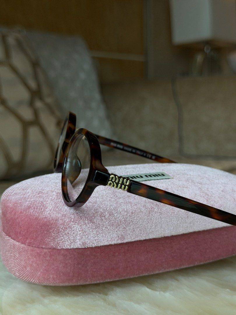 Miu Miu Clear Tortoiseshell Round Eyeglasses (Category: Sunglasses & Eyewear) located in Manila. Submitted by urbanglasses.mnl (Listing ID 1459244069, Image 3). Description: - Sourced from: 🇻🇳 - Stylish tortoiseshell pattern - Classic round frames - Includes Miu Miu case - Can change to prescription frames (lenses need to be replaced).