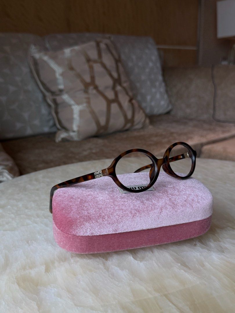 Miu Miu Clear Tortoiseshell Round Eyeglasses (Category: Sunglasses & Eyewear) located in Manila. Submitted by urbanglasses.mnl (Listing ID 1459244069, Image 2). Description: - Sourced from: 🇻🇳 - Stylish tortoiseshell pattern - Classic round frames - Includes Miu Miu case - Can change to prescription frames (lenses need to be replaced).