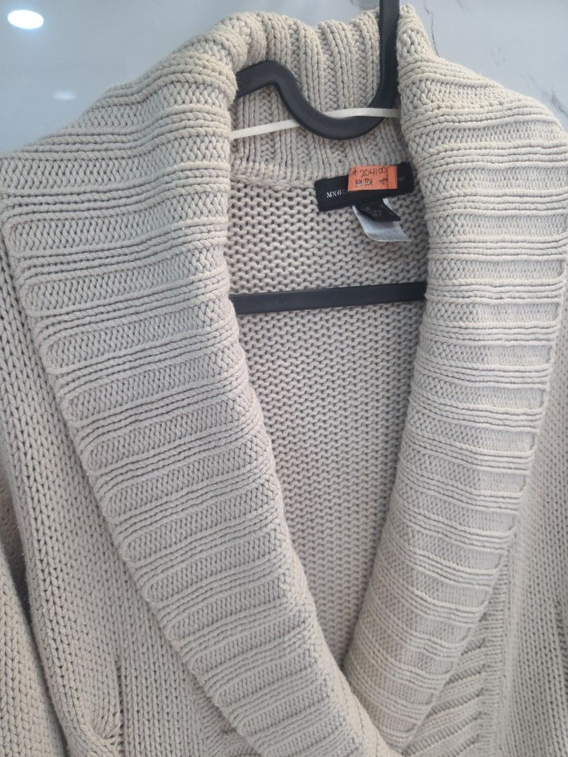 MNG Beige Knit Cardigan with Buttons (Category: Coats, Jackets and Outerwear) located in San Juan City. Submitted by rwongthings (Listing ID 1459133603, Image 2). Description: Mango Beige knit cardigan Dry Cleaned Wrap style with two button closures - Features cable knit details on sleeves and collar - Includes a tie belt for versatile styling - Ideal for layering over outfits.