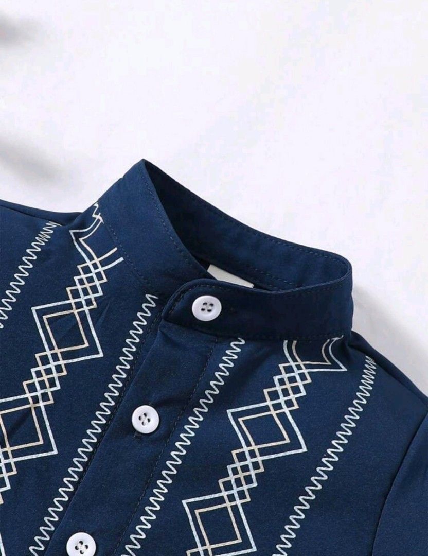 Modern Barong Embroidered Band Collar (Category: Babies & Kids Fashion) located in Quezon City. Submitted by chasingcharmchancecollection (Listing ID 1459263712, Image 3). Description: - Cute navy blue modern barong, not thick type of cloth - Breathable, perfect for infants or toddlers - Features white embroidery on the front - Band collar with button closure - Short sleeves - Ideal for parties or casual wear - Pairs well with black pants but not