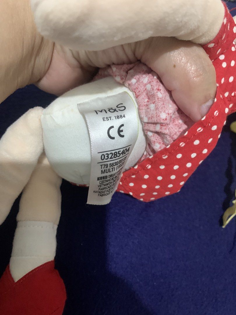 M&S Est. 1884 Red Polka Dot Doll (Category: Plushies & Soft Toys) located in Pasig City. Submitted by miswatamita (Listing ID 1459173179, Image 2). Description: - Adorable M&S doll, approximately 15 inches tall. - Features a charming red dress with white polka dots. - Soft yellow yarn hair adorned with red ribbons. - Complete with a crisp white collar and cute red shoes. - Perfect for playtime or as a delightful decoration. - Wonderfully soft and