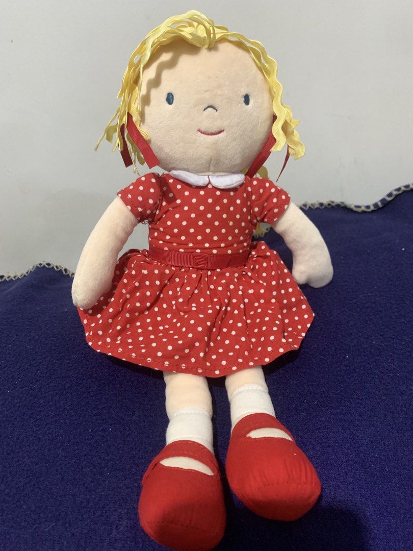 M&S Est. 1884 Red Polka Dot Doll (Category: Plushies & Soft Toys) located in Pasig City. Submitted by miswatamita (Listing ID 1459173179, Image 1). Description: - Adorable M&S doll, approximately 15 inches tall. - Features a charming red dress with white polka dots. - Soft yellow yarn hair adorned with red ribbons. - Complete with a crisp white collar and cute red shoes. - Perfect for playtime or as a delightful decoration. - Wonderfully soft and