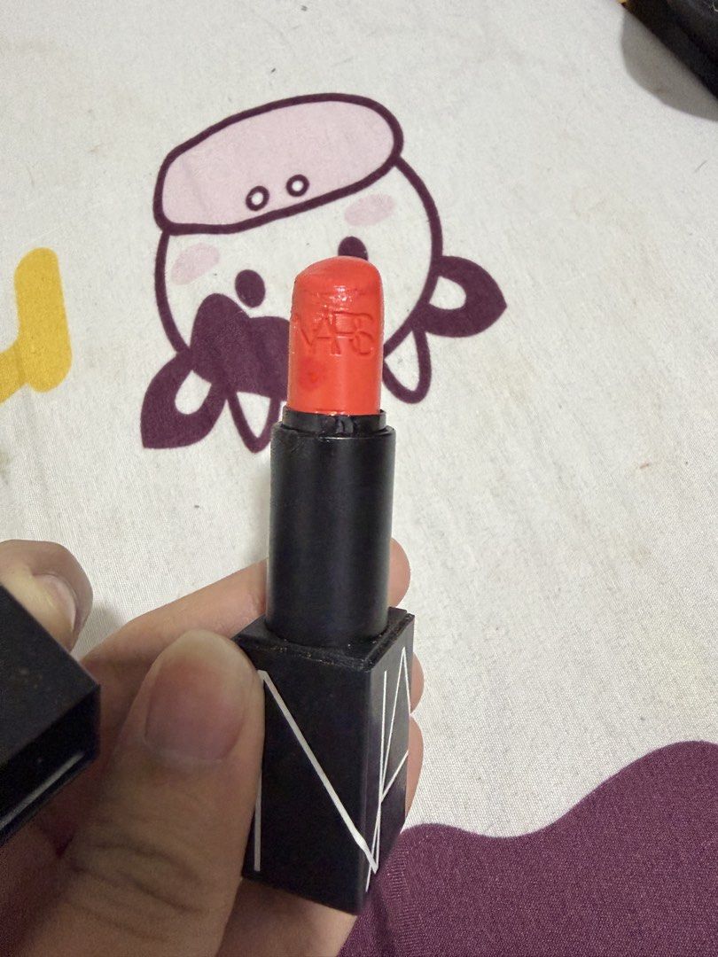 NARS Lipstick - 'Start To Move' - Orange Red (Category: Makeup) located in Valenzuela. Submitted by cheaper_finds (Listing ID 1459208921, Image 2). Description: - NARS Lipstick - Shade: 'Start To Move' - Color: Vibrant orange-red - Condition: Used a few times - NARS logo still visible on bullet - Includes original cap - Adds a great pop of color to any look.