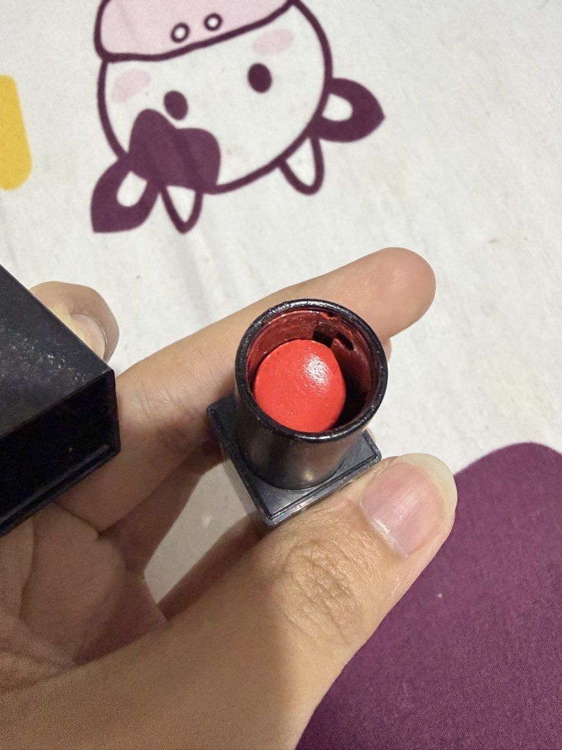 NARS Lipstick - 'Start To Move' - Orange Red (Category: Makeup) located in Valenzuela. Submitted by cheaper_finds (Listing ID 1459208921, Image 3). Description: - NARS Lipstick - Shade: 'Start To Move' - Color: Vibrant orange-red - Condition: Used a few times - NARS logo still visible on bullet - Includes original cap - Adds a great pop of color to any look.