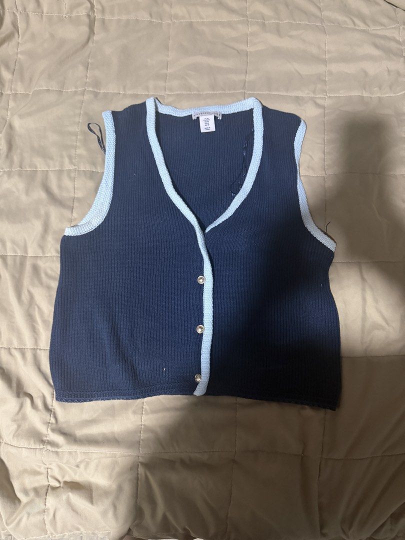 Navy Blue Button-Up Vest with Light Blue Trim (Category: Vests) located in Valenzuela. Submitted by royalstone_05 (Listing ID 1459091669, Image 1). Description: Cute navy blue knit vest with light blue trim and silver buttons. Sleeveless, perfect for layering..