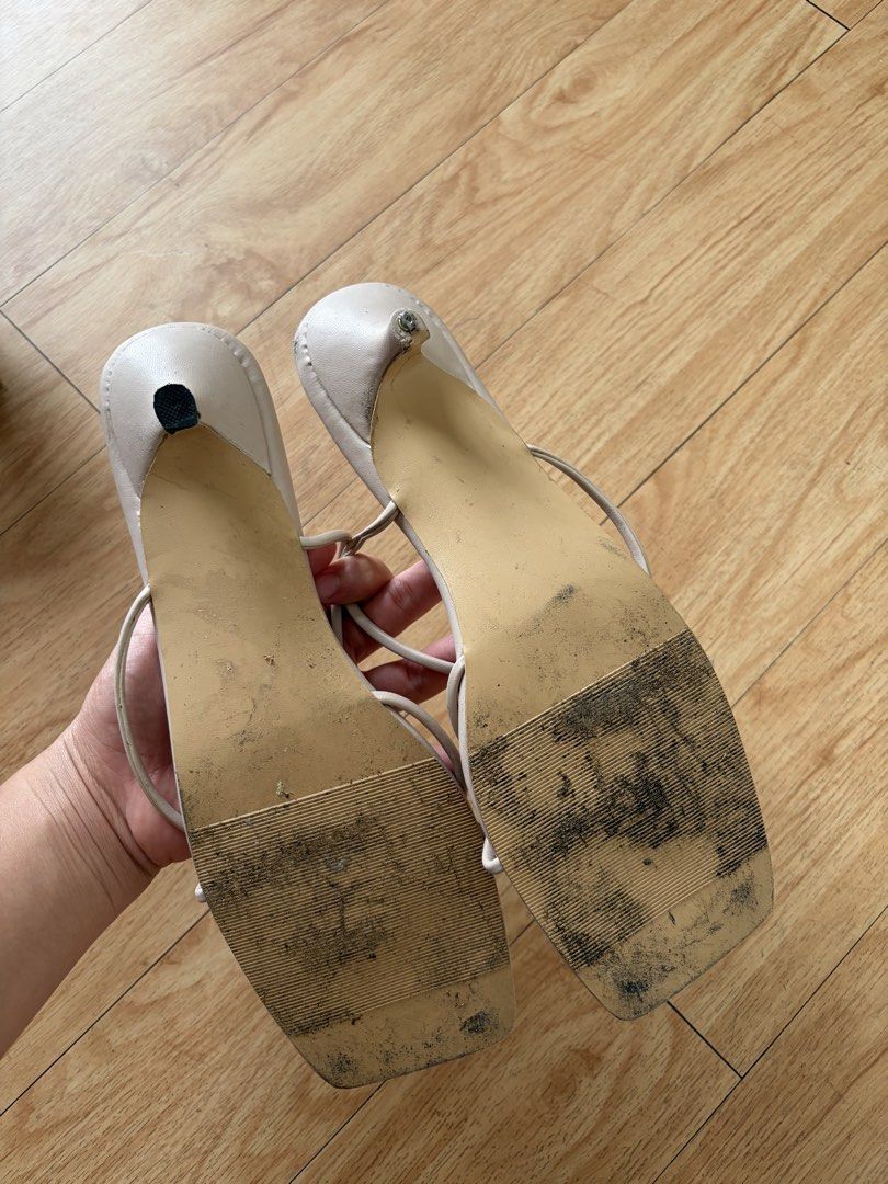 Nicola Square Toe Thong Sandals Cream (Category: Flats & Sandals) located in Muntinlupa City. Submitted by regit_ (Listing ID 1459162142, Image 2). Description: - Brand: Nicola - Color: Cream - Style: Square toe sandals - Features: Thin straps that tie around the ankle, low heel - Condition: scuffing on soles from wear, plenty of life left.