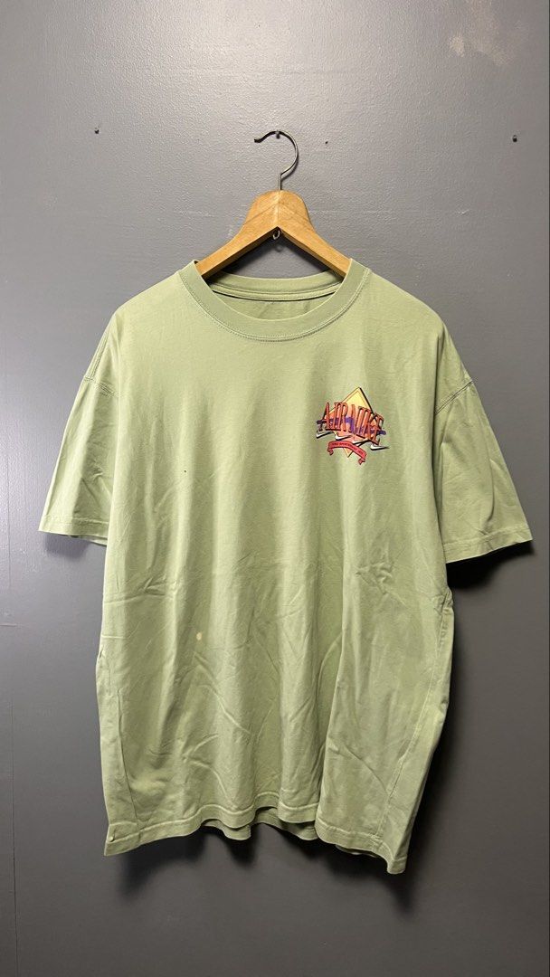 Nike Air T-Shirt Size L (Category: Tshirts & Polo Shirts ) located in Cabuyao City. Submitted by bulandos (Listing ID 1459180511, Image 1). Description: - Light green Nike Air T-shirt - Graphic print on front and back - Size: Large (L) - Made in Vietnam - Minor marks on the front, as pictured.