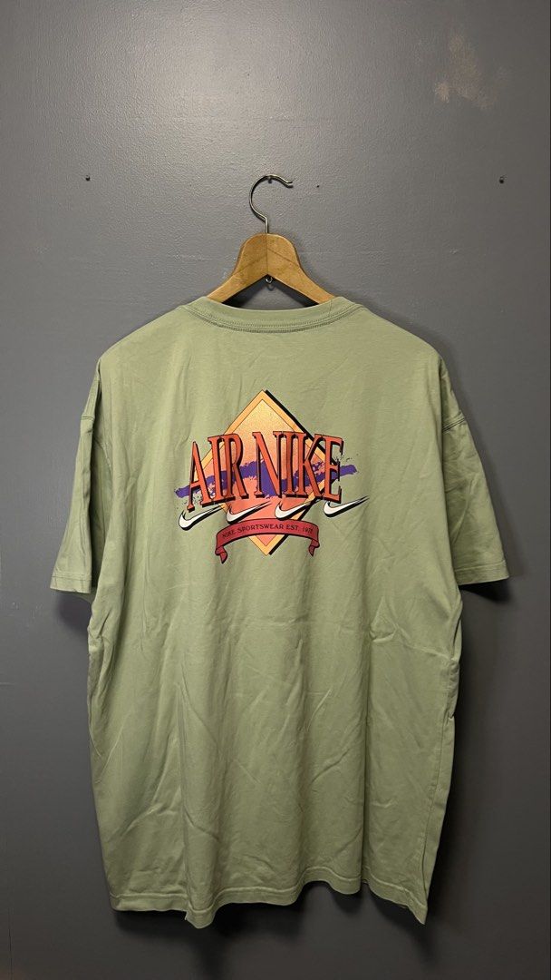 Nike Air T-Shirt Size L (Category: Tshirts & Polo Shirts ) located in Cabuyao City. Submitted by bulandos (Listing ID 1459180511, Image 2). Description: - Light green Nike Air T-shirt - Graphic print on front and back - Size: Large (L) - Made in Vietnam - Minor marks on the front, as pictured.