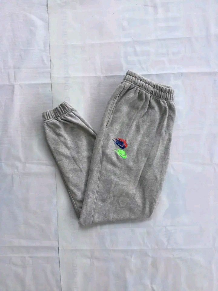 Nike Multi-Colored Swoosh Grey Sweatpants Joggers (Large) (Category: Joggers) located in Caloocan City. Submitted by babradede215 (Listing ID 1459203245, Image 3). Description: Waistline : 28 to 30 Length : 38 Hem : 5 to 7 Color Rate : 9.8/10.