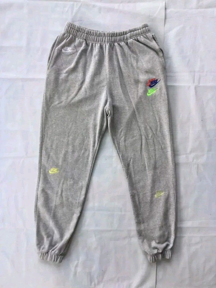 Nike Multi-Colored Swoosh Grey Sweatpants Joggers (Large) (Category: Joggers) located in Caloocan City. Submitted by babradede215 (Listing ID 1459203245, Image 1). Description: Waistline : 28 to 30 Length : 38 Hem : 5 to 7 Color Rate : 9.8/10.