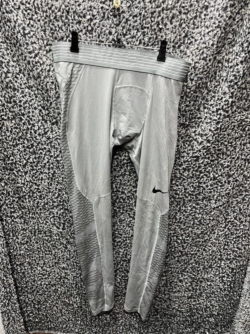 Nike Pro Hypercool Training/Compression Tights | Size XL (Category: Activewear) located in General Trias. Submitted by zrchustle.604 (Listing ID 1459288045, Image 3). Description: Nike Pro Hypercool Training/Compression Tights in grey. This high-performance baselayer features a micro-textured horizontal knit pattern, ergonomic flatlock stitching to prevent chafing, and distinct targeted mesh ventilation panels with a geometric cross-hatch pattern