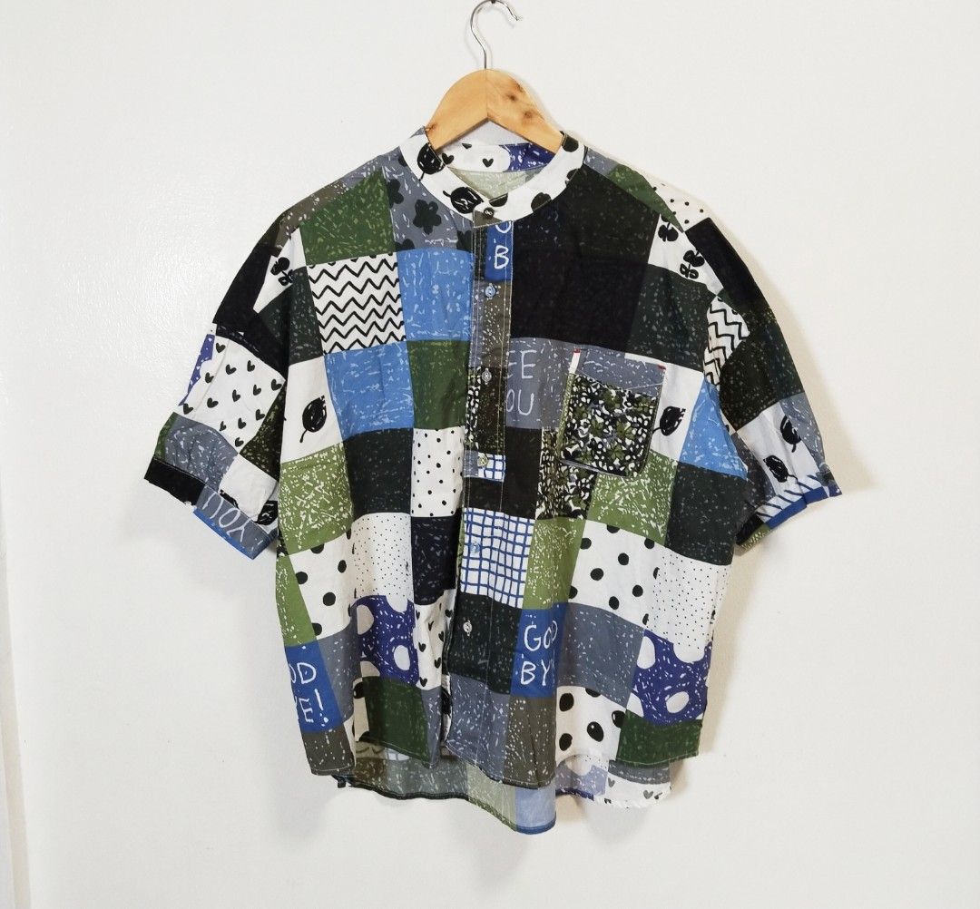 Niko and Patchwork Button-Up Shirt with Collar (Category: Blouses) located in Pateros City. Submitted by blashjunks.y2k (Listing ID 1459188314, Image 2). Description: - Unique patchwork print shirt - Features a stylish mandarin collar - Comfortable short sleeves - Convenient chest pocket - Ideal for a casual, artsy aesthetic - Effortless to style for any occasion.