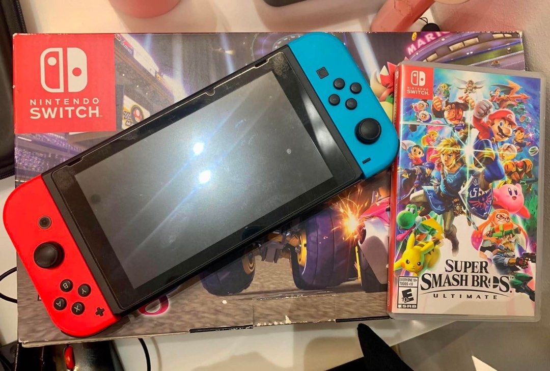 Nintendo Switch - Complete Boxed Set + Free Game (Category: Nintendo) located in Manila. Submitted by goodfindstudio.ph (Listing ID 1459181915, Image 1). Description: For sale : Nintendo Switch (complete set with Box) 🎮🎮 with FREE Super Smash Bros RFS: Very rare to use.