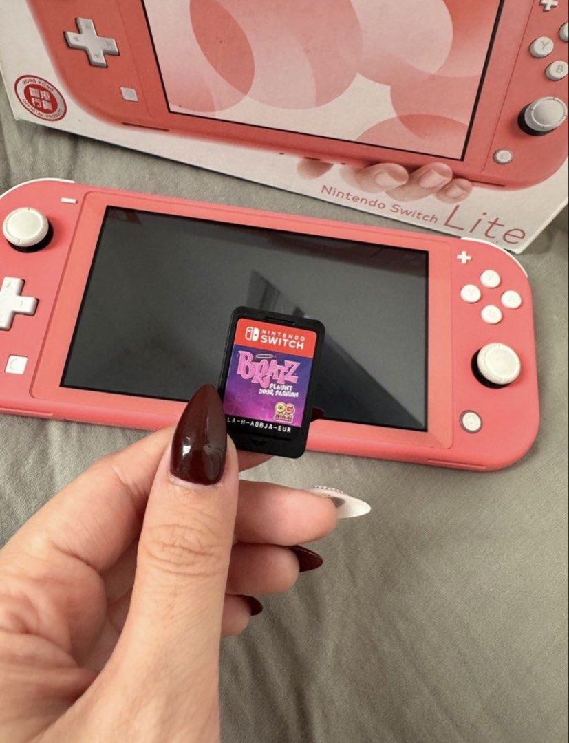 Nintendo Switch Lite (Category: Nintendo) located in Paranaque City. Submitted by shopizzag (Listing ID 1459246779, Image 2). Description: -used thrice -good as new -free bratz game -free protector and screen protector -comes with charger.