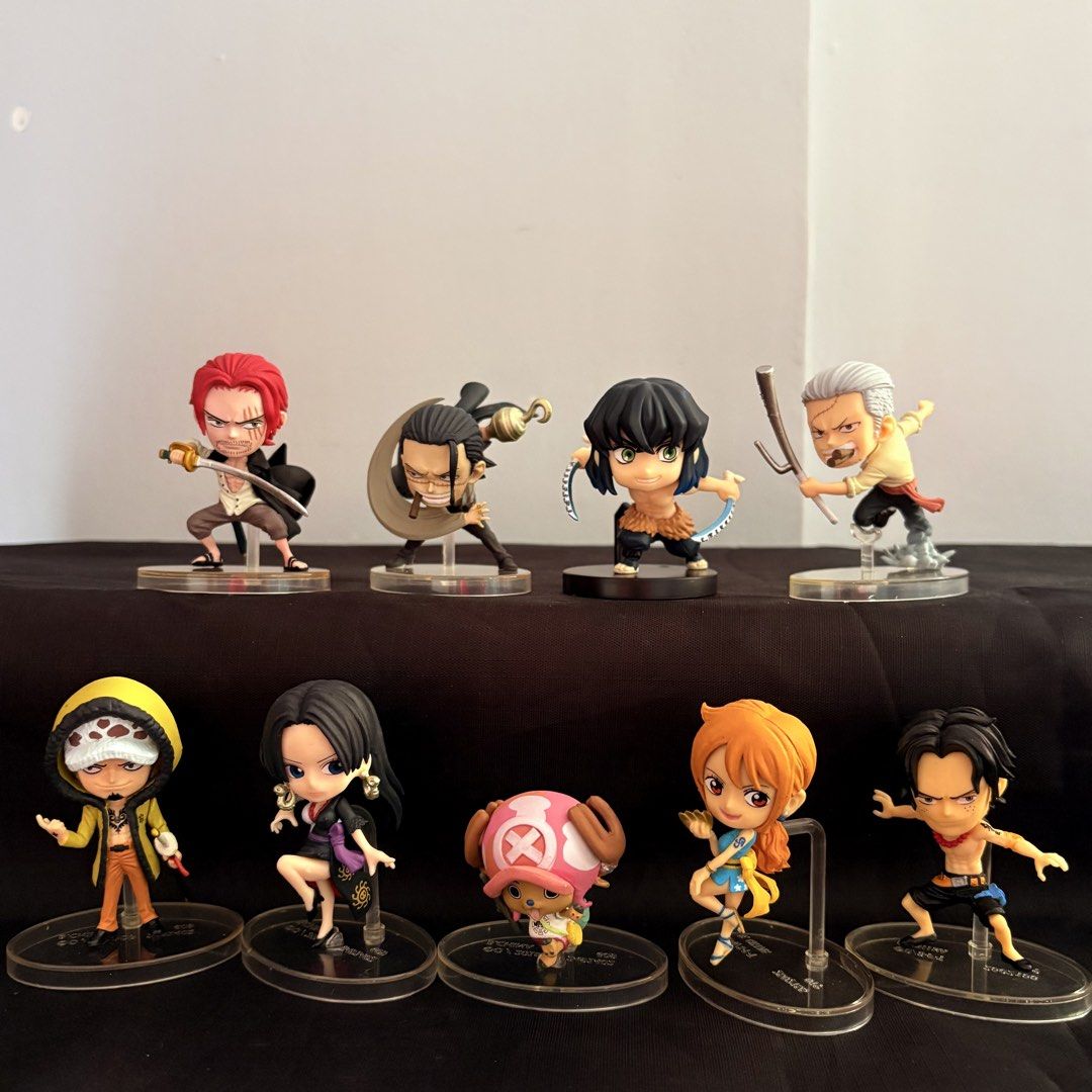 One Piece Chibi Figures Set (Category: Figurines & Statues) located in Manila. Submitted by tj.merch (Listing ID 1459250524, Image 1). Description: - Set of 9 One Piece chibi figures - Includes: Shanks, Crocodile, Inosuke, Garp, Law, Boa Hancock, Chopper, Nami, Ace - Each figure comes with its own individual stand - Ideal for anime fans and collectors - Can be displayed together or separately.