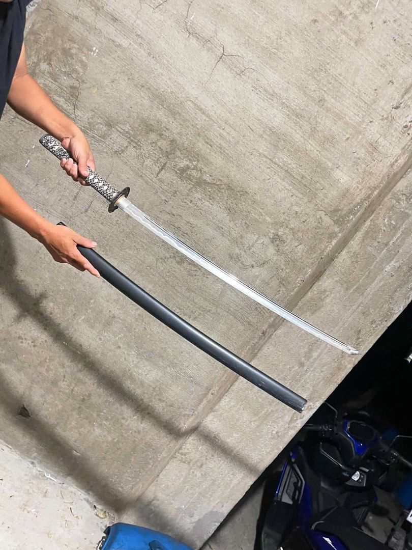 Original Katana Sword with Scabbard From Japan (Category: Vintage Collectibles) located in Antipolo. Submitted by katsuren (Listing ID 1459134349, Image 1). Description: Bocaue, Bulacan Locatiin - Authentic-looking katana sword - Includes a sleek black scabbard - Handle features a detailed patterned grip - Ideal for display or adding to your collection - Feel free to ask any questions!.