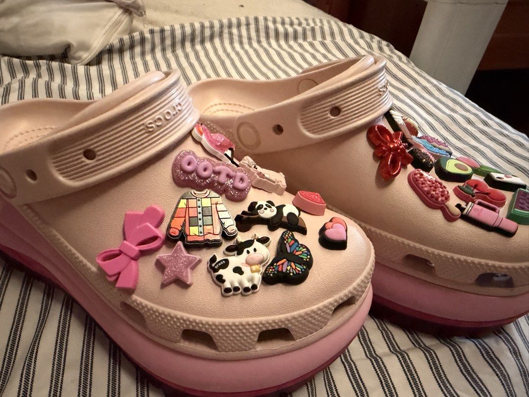 Pink Crocs with Charms (Category: Slippers and slides) located in Manila. Submitted by danielchuuu (Listing ID 1459278357, Image 3). Description: Rush Sale po Crocs Platform Size 6 Womens Bought in Canada All Jiblitz Original Worn twice only. Offer po ng Price thanks! - Adorable pink Crocs - Comes with a variety of fun charms (food, animals, and more!) - Easy slip-on design - Comfortable for all-day wear - Perfect for adding a playful touch to an