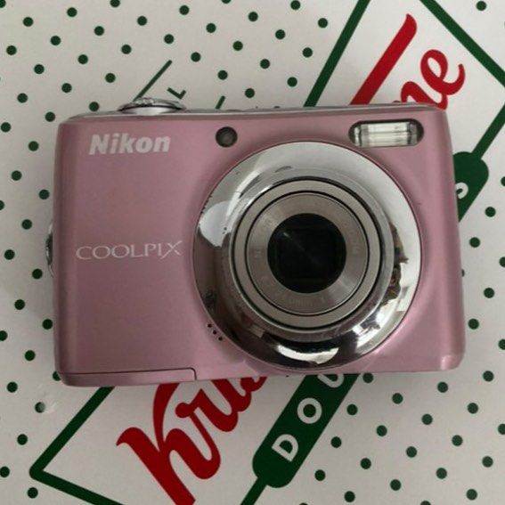 Pink Nikon Coolpix L21 Digital Camera (Category: Cameras) located in Manila. Submitted by trixfth (Listing ID 1459222280, Image 1). Description: - Compact and easy to use - Great for everyday photos - Comes with a wrist strap - Reliable for your next adventure - Have Minor Scratches but don't affect the picture - Battery storage needs to be clipped or taped because the lock is loose, but no problem even when taped only..