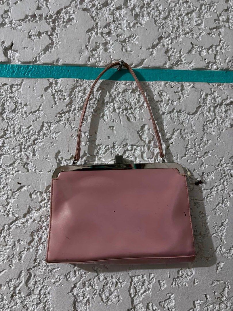 Pink shoulder bag with silver clasp (Category: Shoulder Bags) located in Manila. Submitted by catapusanm59499 (Listing ID 1459111579, Image 1). Description: - Adorable pink shoulder bag - Secure silver clasp closure - Thin faux leather strap - Minor exterior scuffs visible in photos - Ideal for carrying your daily essentials.