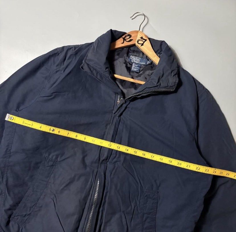 Polo Ralph Lauren Navy Blue Zip-Up Jacket (Category: Coats, Jackets and Outerwear) located in Quezon City. Submitted by dfgdam (Listing ID 1459109851, Image 3). Description: - Navy blue Polo Ralph Lauren jacket - Full zip-up front with stand-up collar - Two side pockets - Adjustable drawstring hem - Versatile for layering or standalone wear - Classic and timeless style .