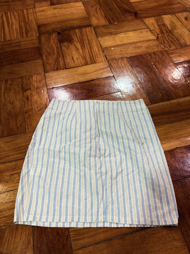 Pomelo Striped Mini Skirt XL (Category: Skirts) located in Carmona. Submitted by prelovedbyallia (Listing ID 1459213727, Image 2). Description: Pomelo Striped Mini Skirt in XL •Colors: Light Blue & Beige Stripes •Closure: Zipper at the back •Occasion: Great for casual wear or dressing up • RFS: Too big! Only worn once MOP: GCash, BDO, or BPI MOD: J&T or Lalamove (shipping fee is shouldered by the buyer) Reminders: • Please manage your expectation