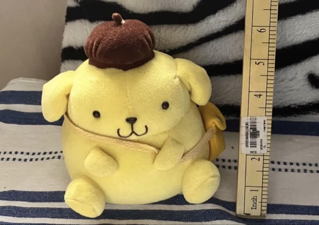 Pompompurin with sling bag plush (Category: Plushies & Soft Toys) located in Paranaque City. Submitted by bonsaiart (Listing ID 1459211483, Image 1). Description: Pre owned Good condition 730+sf Payment via GCASH or paymaya No to meetup No to cop / cod Shipping via j&t only.