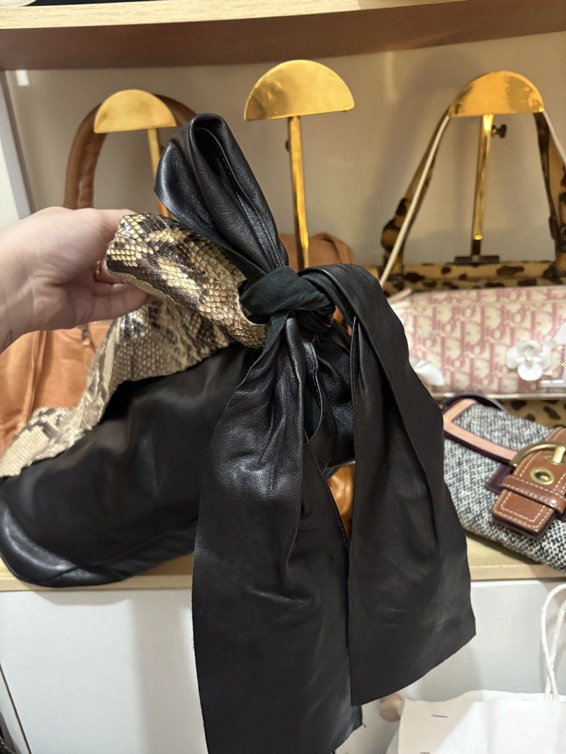 Prada Python Vintag Bag (Category: Luxury Bags & Wallets) located in Las Pinas. Submitted by xoxuryam (Listing ID 1459242487, Image 3). Description: - super pretty - can remove the strap - can be clutch and sling bag - guaranteed authentic .