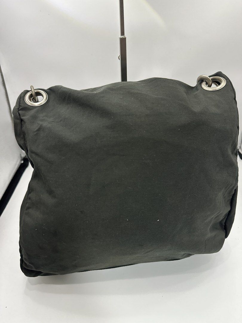 Prada Tessuto Shoulder Bag Dark Green (Category: Luxury Bags & Wallets) located in Baguio. Submitted by luxukayukay (Listing ID 1459242731, Image 2). Description: - Authentic Prada shoulder bag - Made in Italy - 100% Polyamide exterior - 100% Nylon lining - Red Prada logo tab - Adjustable strap - Interior zip pocket - Ideal for everyday use.