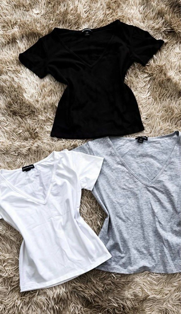PrettyLittleThing V-Neck Basic Tees (Black, White, Grey) (Category: Shirts) located in Antipolo. Submitted by mel.hernandez (Listing ID 1459203706, Image 1). Description: - Bundle of 3 PrettyLittleThing V-neck tees - Colors: Black, White, Light Grey - Material: Soft and comfortable - Perfect for everyday wear or layering.