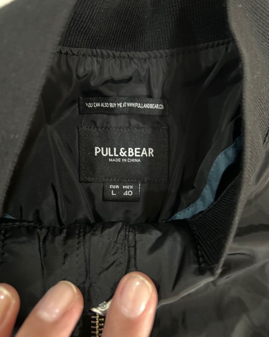 MARKDOWN!! Pull & Bear Black Bomber Jacket Size L (Category: Coats, Jackets and Outerwear) located in Quezon City. Submitted by strangesuitcase (Listing ID 1459212816, Image 2). Description: - Brand: Pull & Bear - Style: Bomber Jacket - Color: Black - Size: L - Features: Zip-up front, zippered chest pocket - Details: Ribbed collar, cuffs, and hem - Styling: Great for casual layering and easy to style..