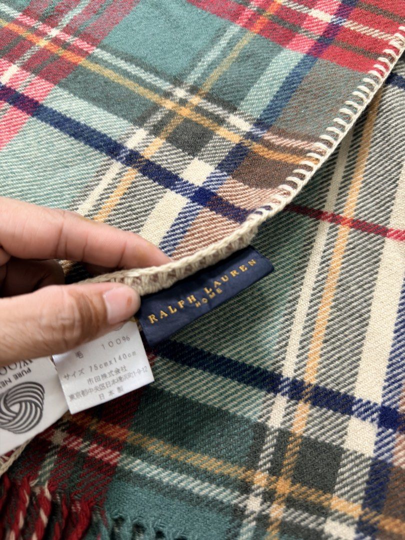 Ralph Lauren Home Plaid wool blanket (Category: Scarves) located in Alfonso. Submitted by jbcamet (Listing ID 1459211764, Image 3). Description: - Authentic Ralph Lauren Home plaid scarf - Made from 100% premium wool - Generous size: 75cm x 140cm - Elegant fringe trim detail - Iconic embroidered Ralph Lauren polo player logo - Adds warmth and sophisticated style to any outfit - Ideal for autumn and winter seasons.