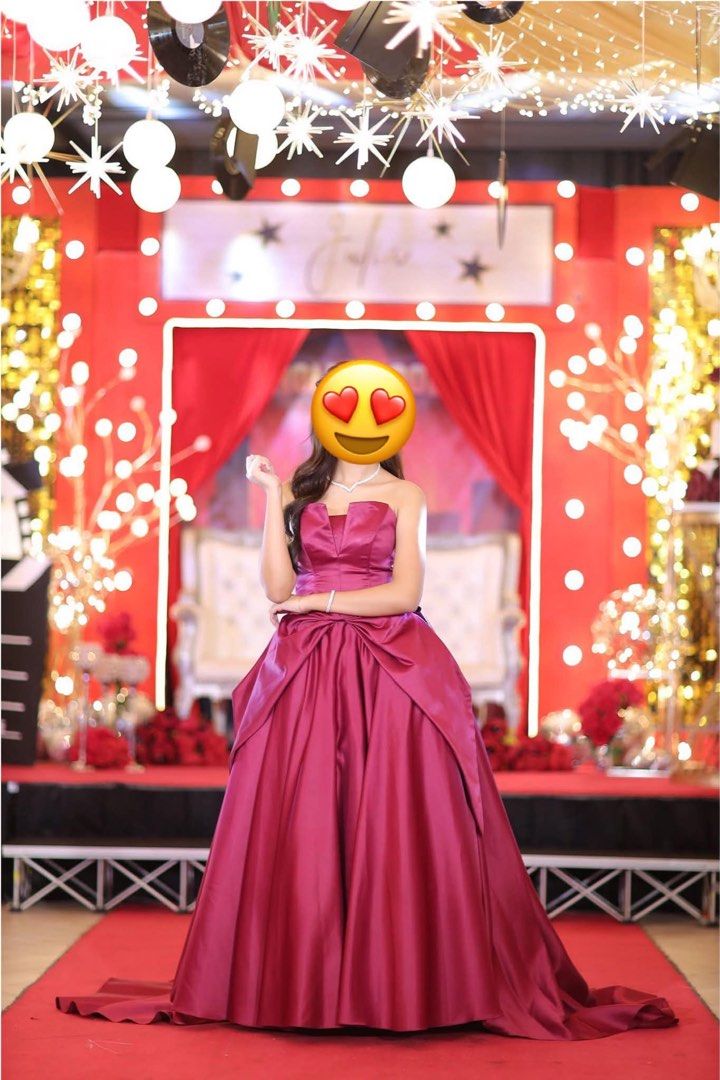 Red Strapless Ball Gown with Large Bow (Category: Evening dresses & gowns) located in Paranaque City. Submitted by shopnichoppy (Listing ID 1459126839, Image 2). Description: - Beautiful red strapless ball gown - Features a large satin bow at the back - Full skirt with a train - Perfect for formal events, proms, or debutante balls - Includes a matching underskirt for extra volume - Worn only once for a special occasion - Stored carefully.