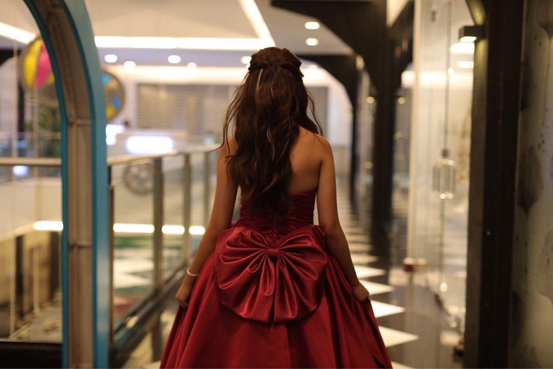 Red Strapless Ball Gown with Large Bow (Category: Evening dresses & gowns) located in Paranaque City. Submitted by shopnichoppy (Listing ID 1459126839, Image 1). Description: - Beautiful red strapless ball gown - Features a large satin bow at the back - Full skirt with a train - Perfect for formal events, proms, or debutante balls - Includes a matching underskirt for extra volume - Worn only once for a special occasion - Stored carefully.