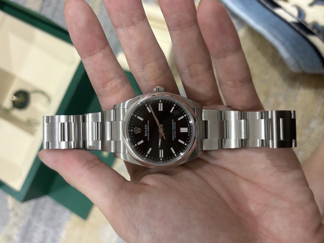 Rolex Oyster Perpetual 126000 Black Dial (Category: Watches) located in Singapore. Submitted by dogeater8277 (Listing ID 1459287371, Image 2). Description: - Rolex Oyster Perpetual Watch - Model: 126000 - Dial Colour: Black - Purchase Date: 19-03-2026 - Includes: Original Box & International Guarantee Card - Condition: Selling as is -up for Nego -can dm for more pictures.