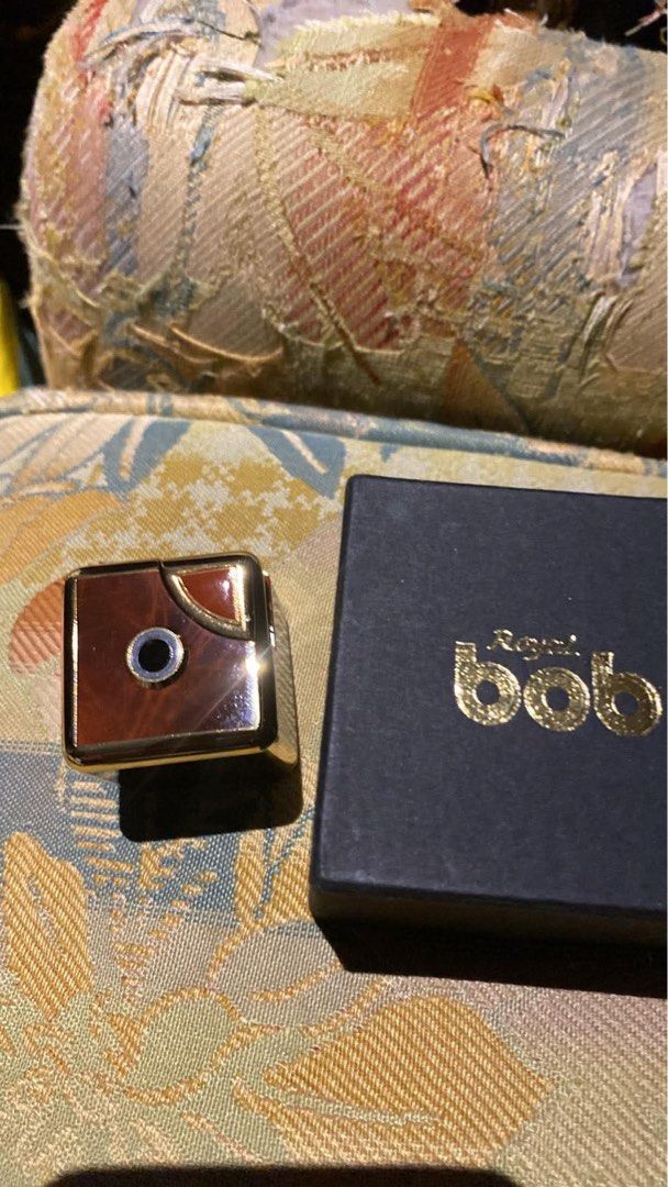 Ronson Bob Japan Gold Lighter with Box (Category: Vintage Collectibles) located in Manila. Submitted by batmantr (Listing ID 1459284469, Image 1). Description: - Vintage Ronson Bob lighter - Gold tone finish with wood-like inlay - Made in Japan - Comes with original box - Excellent collectible piece - Suitable for display or practical use.