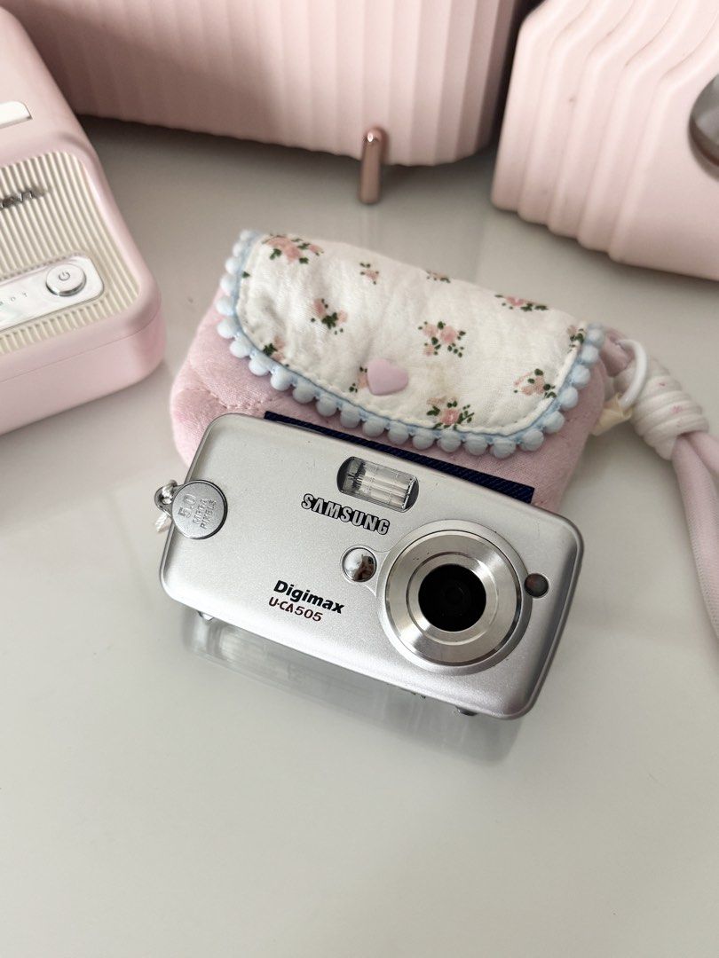 Samsung Digimax U-CA505 Silver Digital Camera Digicam (Category: Cameras) located in Marilao. Submitted by toutlemonde (Listing ID 1459260305, Image 1). Description: - 5.2 MP CCD sensor - 3x optical zoom - can take photos and videos - 9/10 cosmetic condition - uses SD card (not included) Issue: flash was recently working (as shown in the actual photo posted) but suddenly stopped working. the flash may need a battery replacement/repair to work aga