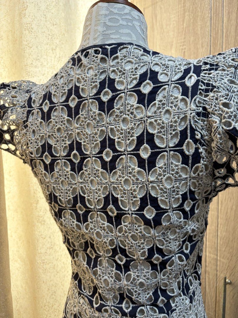 Sandro Paris Navy Lace Flutter Sleeve Dress (Category: Dresses) located in Pasig City. Submitted by k8s_charm_est.2021 (Listing ID 1459189581, Image 3). Description: Small to semi M L: 32 inches - Navy blue Sandro Paris dress - Intricate lace overlay - Flutter sleeves - V-neckline with drawstring waist - Flared hemline - Ideal for parties or a night out - Includes original packaging.