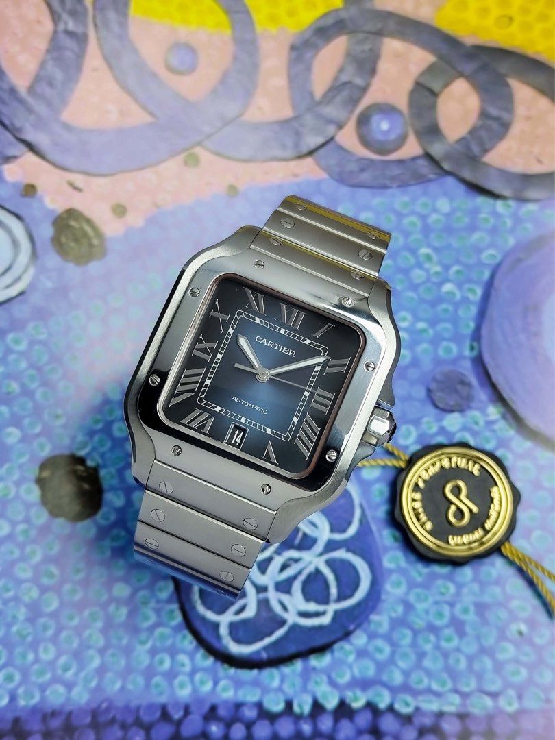 Santos Large Blue Dial (Category: Men's Watches) located in Makati City. Submitted by swissperpetual (Listing ID 1459117685, Image 3). Description: Cartier Santos De Cartier Blue Dial Large 39.8 x 47.5 mm WSSA0013 2019 Complete set (-2 Links) Condition: 9/10 (Excellent condition) Price: P438,000 Negotiable 🤝 7 Day Moneyback Guarantee 🧑‍🔧 1 Year SP Service Warranty 💱 Trades Offers and Pre-orders Accepted 💳 Credit Card Options Available 🪙 Lay