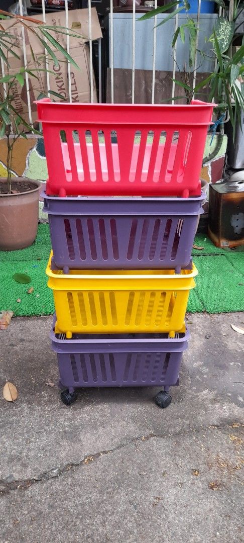 Set of 4 Stackable Storage Baskets with Wheels (Category: Storage Boxes & Baskets) located in Valenzuela. Submitted by newbear.425b6e (Listing ID 1459119906, Image 2). Description: - Set of 4 colorful storage baskets - Colors include: Red, Purple, Yellow, and another Purple - Stackable design for space-saving storage - 2 baskets feature wheels for easy transport - Ideal for organizing toys, books, and various items -surplus 900 only..