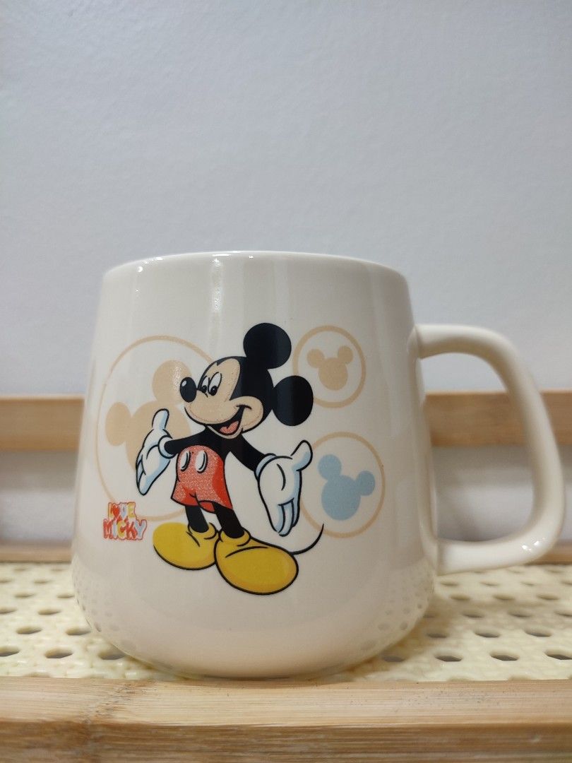 Set of 7 Mugs - Various Designs (Category: Coffee & Tea Tableware) located in Manila. Submitted by messiscar290860 (Listing ID 1459203384, Image 3). Description: - Set of 7 unique mugs - 3 Black mugs with elegant gold handles - 2 Purple mugs featuring fun cartoon characters - 1 Cheerful yellow mug with a cartoon design - 1 Classic white mug with iconic Mickey Mouse - 1 Plain white mug with a distinctive purple handle - 1 Textured white mug with a