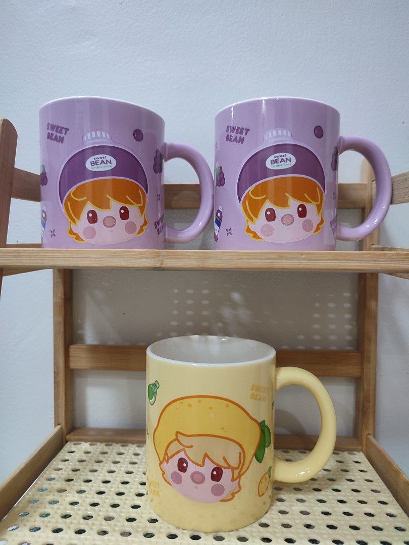 Set of 7 Mugs - Various Designs (Category: Coffee & Tea Tableware) located in Manila. Submitted by messiscar290860 (Listing ID 1459203384, Image 2). Description: - Set of 7 unique mugs - 3 Black mugs with elegant gold handles - 2 Purple mugs featuring fun cartoon characters - 1 Cheerful yellow mug with a cartoon design - 1 Classic white mug with iconic Mickey Mouse - 1 Plain white mug with a distinctive purple handle - 1 Textured white mug with a